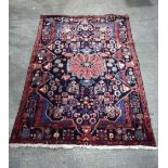 An Iranian wool rug 243 x 155 cm