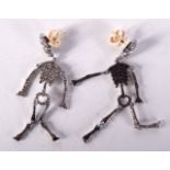 A PAIR OF DIAMOND SKELETON EARRINGS. 6 grams. 5 cm x 1 cm.