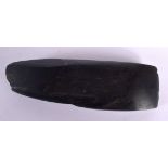 A STONE AXE HEAD. 15cm x 4.7cm x 2.4cm