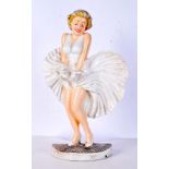 A cast iron Marilyn Munro door stop 34 cm.