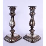 A PAIR OF ANTIQUE OLD SHEFFIELD PLATES CANDLESTICKS. 21 cm high.