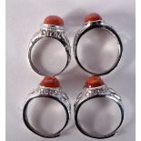 FOUR SILVER AND CORAL RINGS. 13 grams. M, O & R. (4)