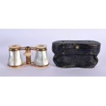 A CASED PAIR OF VICTORIAN MOTHER OF PEARL OPERA GLASSES. 7 cm x 9 cm extended.