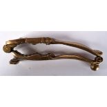 A PAIR OF ANTIQUE BRONZE NUT CRACKERS. 14 cm x 3 cm.