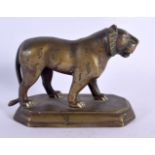 A 19TH CENTURY MIDDLE EASTERN INDIAN BRONZE FIGURE OF A TIGER modelled upon a shaped plinth. 13 cm x