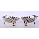 A PAIR OF ANTIQUE SILVER SHELL SALTS. 147 grams. 9 cm x 8.5 cm.