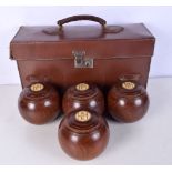 A collection of vintage Slazenger's stadium bowls together with a leather case