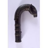 AN 18TH/19TH CENTURY MIDDLE EASTERN MUGHAL BRONZE CANE HANDLE formed as a stylised horse. 16 cm x 8