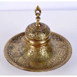 An Islamic embossed brass inkwell 15 x 12 cm