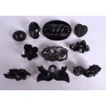 A COLLECTION OF ANTIQUE JET BROOCHES. 88 grams. Largest 6.5 cm x 4.5 cm. (qty)