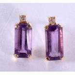 A PAIR OF 14CT GOLD AMETHYST AND DIAMOND EARRINGS. 2 grams. 1.5 cm x 0.5 cm.