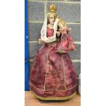 A LARGE EARLY VICTORIAN PAINTED WOODEN DOLL with child. 95 cm x 28 cm.