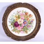 superb early 19th c. English porcelain plaque lavishly painted with flowers in a circular gilded fra