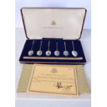 A SET OF SIX 22CT GOLD PLATED SILVER AND ENAMEL SPOONS. Birmingham 1978. 50 grams. 10 cm long. (6)
