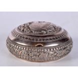 AN INDIAN WHITE METAL REPOUSSE BOX. 62 grams. 2.75 cm x 6 cm.