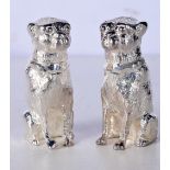 A PAIR OF SILVER PLATED DOG SALT AND PEPPER CONDIMENTS. 274 grams. 6.5 cm x 4 cm.