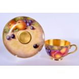 A ROYAL WORCESTER FRUIT PAINTED CUP AND SAUCER by Freeman. 13.5 cm wide.