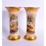 A PAIR OF ROYAL WORCESTER PORCELAIN VASES by James Stinton. 19 cm high.