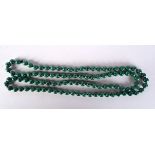 A MALACHITE NECKLACE. 61 grams. 90 cm long.