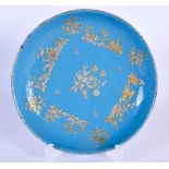 A 19TH CENTURY FRENCH BLUE TIN GLAZED ENAMEL DISH overlaid with gilt vines. 16 cm wide.