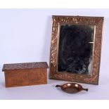AN ARTS AND CRAFTS KESWICK COPPER MIRROR together with a box and cup. Largest 28 cm x 24 cm. (3)