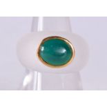 A CRYSTAL AND JADE RING. 6 grams. N.