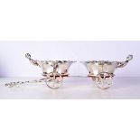 A SILVER PLATED CHERUB COASTER CART. 45 cm long.