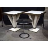 A pair of large wooden tables together with a metal mirrored occasional table