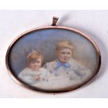 AN EDWARDIAN DUAL PORTRAIT IVORY MINIATURE painted with a young boy and girl. 45.9 grams 8 cm x 9 cm