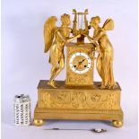 A LARGE EARLY 19TH CENTURY FRENCH ORMOLU MANTEL CLOCK formed with figures beside a lyre. 42 cm x 28