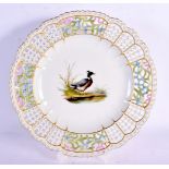 A GERMAN MEISSEN PORCELAIN RETICULATED PLATE painted with a duck within a landscape. 24 cm wide.