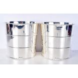 A PAIR OF SILVER PLATED BARREL WINE COOLERS. 21 cm x 21 cm.