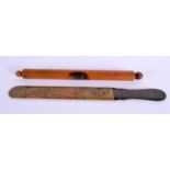AN ANTIQUE MAUCHLINEWARE ROLLING PIN and a similar page turner. Largest 32 cm long. (2)