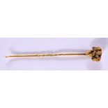 A GOLD NUGGET HAT PIN. 3.5 grams. 6.5 cm long.