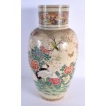 A LARGE 19TH CENTURY JAPANESE MEIJI PERIOD SATSUMA VASE painted with birds in landscapes. 40 cm x 18