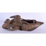 AN UNUSUAL 19TH CENTURY CONTINENTAL TRIBAL CARVED WOOD FIGURE OF DUCKS with rope twist hanging handl