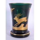 AN ANTIQUE BOHEMIAN GREEN AND GILT GLASS BEAKER. 12 cm x 8 cm.