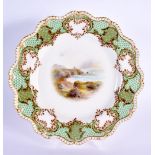 Royal Worcester lobed gadroon edged shaped plate painted with a seascape and rocky cliff under a gr