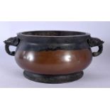 A CHINESE TWIN HANDLED BRONZE CENSER 20th Century. 19 cm wide, internal width 13 cm.