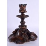 A LARGE 19TH CENTURY BAVARIAN BLACK FOREST CARVED WOOD CANDLESTICKS overlaid with leaves. 26 cm x 12