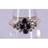 AN 18CT GOLD DIAMOND AND SAPPHIRE RING. 2.9 grams. J.