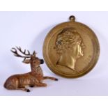 AN ANTIQUE AUSTRIAN COLD PAINTED SPELTER DEER and a medallion. Largest 15 cm diameter. (2)