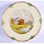Royal Crown Derby plate painted by W. E. J. Dean, signed, with a river landscape of Haddon Hall, na