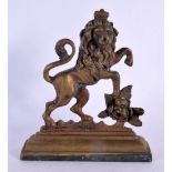 AN ANTIQUE BRONZE LION DOOR STOP. 15 cm x 12 cm.