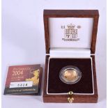 A 1/10 OZ GOLD PROOF COIN. 3.4 grams. 1.5 cm wide.