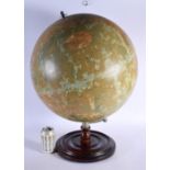 A VERY LARGE RARE ANTIQUE PHILIPS 19 INCH TERRESTRIAL GLOBE upon a mahogany plinth. 68 cm x 38 cm.