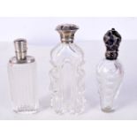 THREE ANTIQUE SILVER TOPPED BOTTLES. 10 cm x 4 cm. (3)