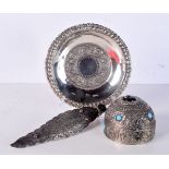 AN INDIAN WHITE METAL DISH together with two white metal turquoise inset pieces. 450 grams. Largest