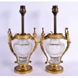 A PAIR OF 19TH CENTURY FRENCH GILT BRONZE AND CRYSTAL GLASS LAMPS with figural mounts. 32 cm x 15 cm