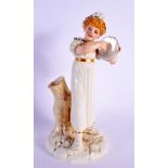 A HADLEYS WORCESTER FIGURE OF A TAMBORINE PLAYER. 22 cm high.